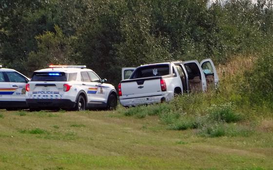 police-and-investigators-are-seen-at-the-side-of-the-road-outside-rosthern-saskatchewan-on